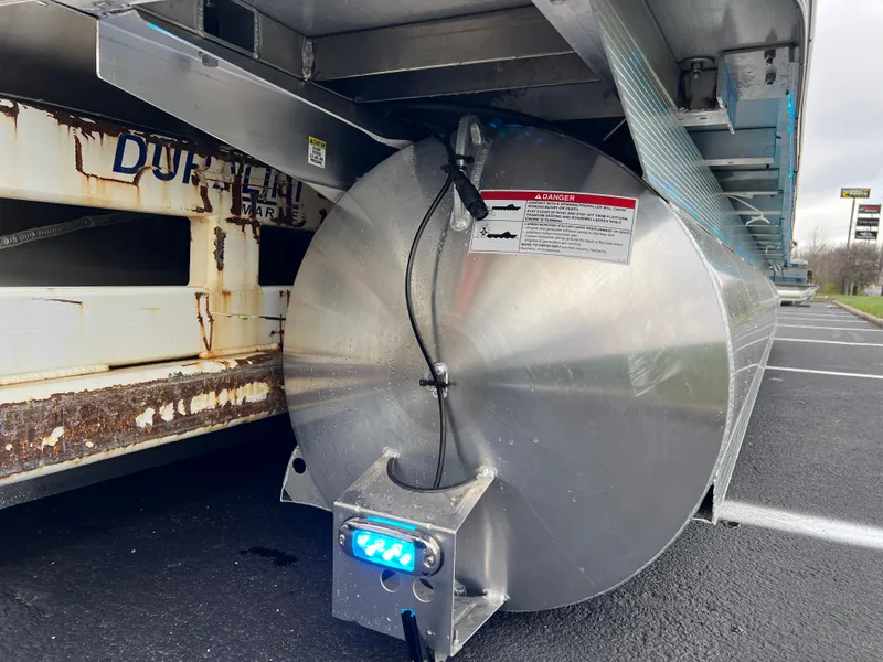 Slide: The Image of 2025 South Bay 523 ULE 3.0+ pontoon trailer with metal components and wiring. - 5