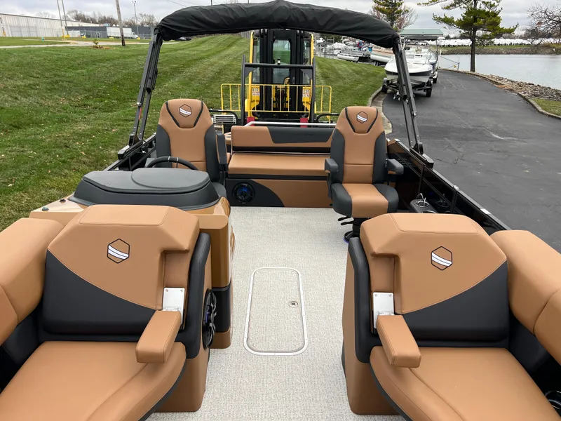 Slide: The Image of 2025 South Bay 523 ULE 3.0+ pontoon boat with tan and black seating. - 8