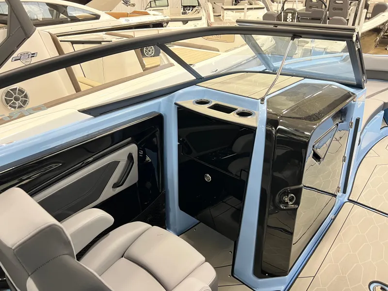 Slide: The Image of Interior of 2025 Yamaha Boats 255XD, featuring sleek design and modern seating. - 10