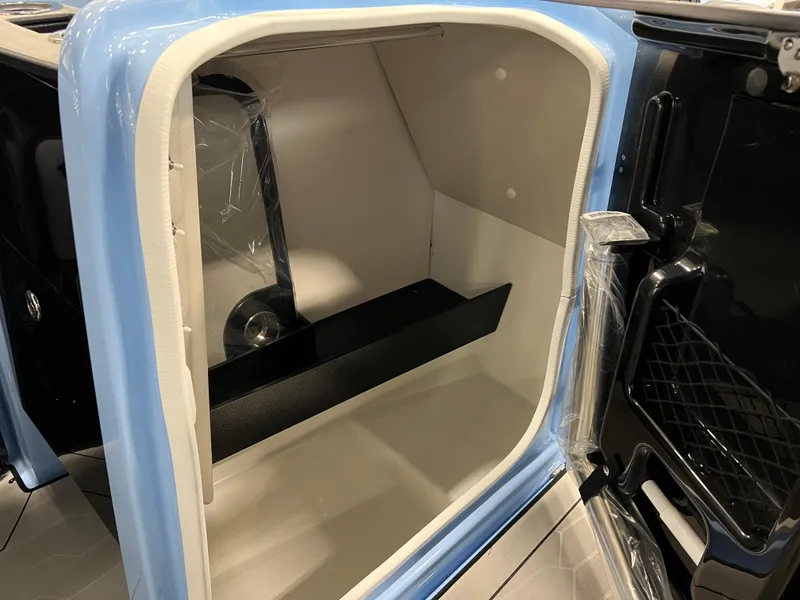 Slide: The Image of 2025 Yamaha Boats 255XD storage compartment, featuring sleek interior design and modern finishes. - 11