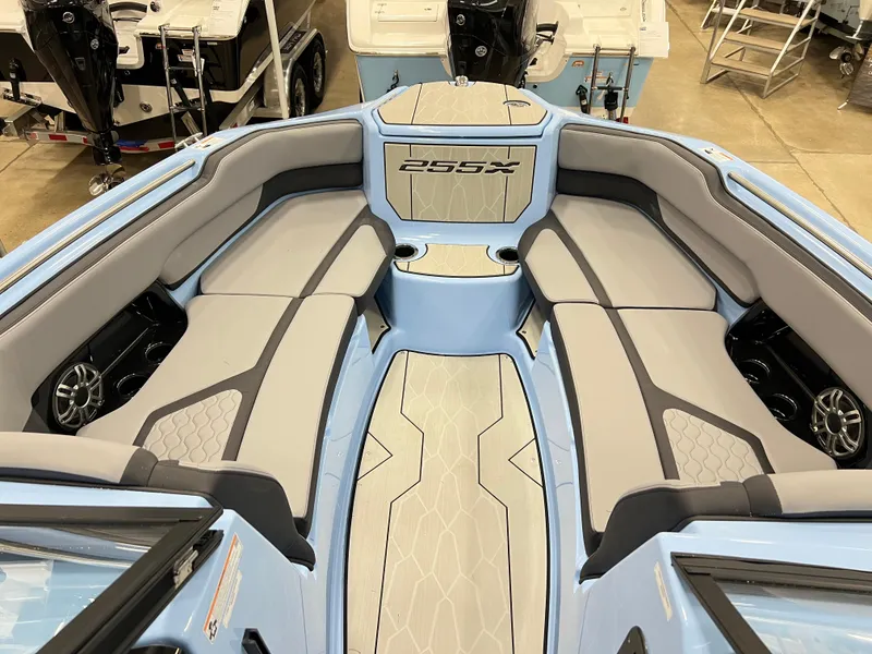 Slide: The Image of 2025 Yamaha Boats 255XD interior with sleek seating and modern design. - 12