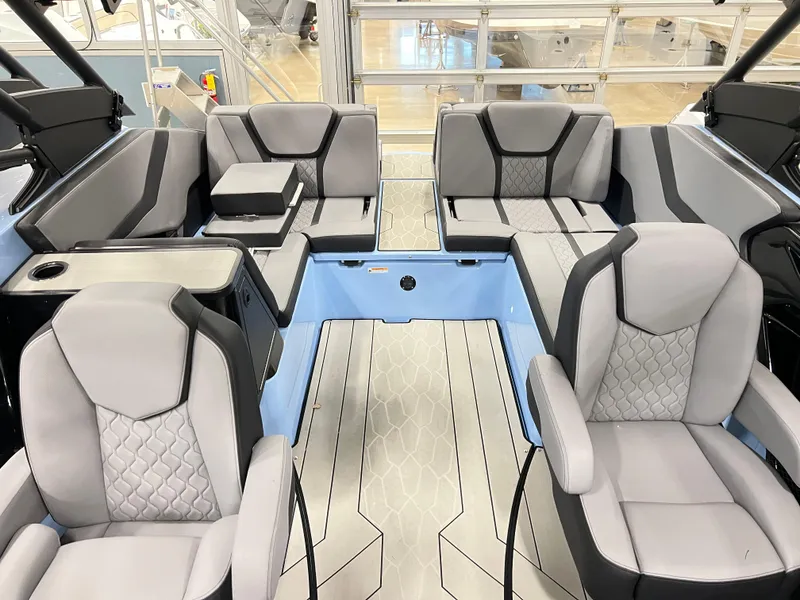 Slide: The Image of 2025 Yamaha Boats 255XD interior with modern seating and sleek design. - 13