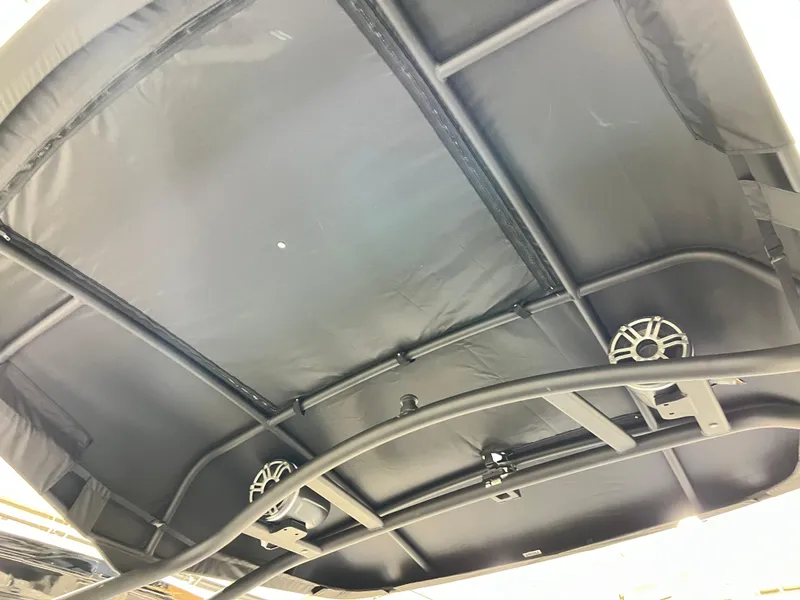 Slide: The Image of Underneath view of 2025 Yamaha Boats 255XD canopy with integrated speakers. - 14