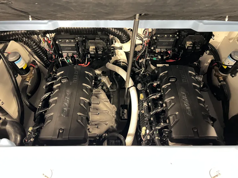 Slide: The Image of 2025 Yamaha Boats 255XD engine compartment with dual engines and wiring. - 15