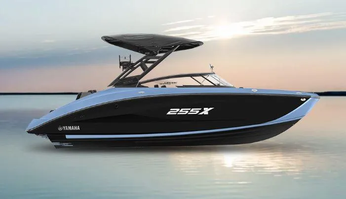 Slide: The Image of 2025 Yamaha Boats 255XD on calm water at sunset. - 17