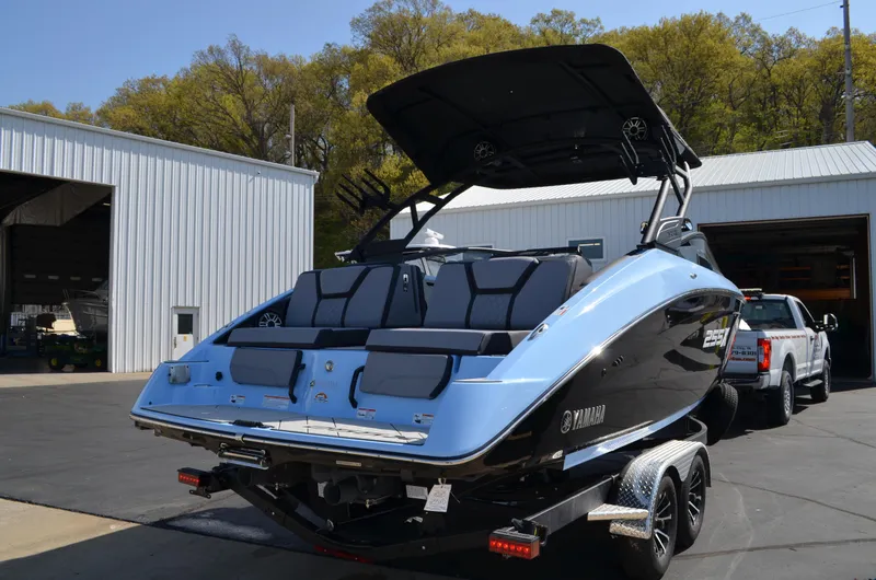 Slide: The Image of 2025 Yamaha Boats 255XD in a parking lot, showcasing sleek design and modern features. - 3