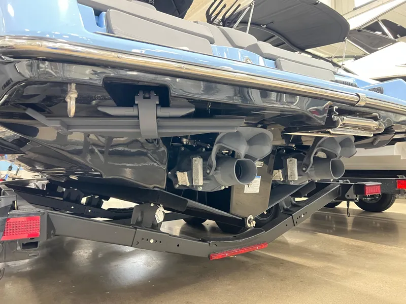 Slide: The Image of 2025 Yamaha Boats 255XD rear view, showcasing dual exhausts and sleek design on a trailer. - 7