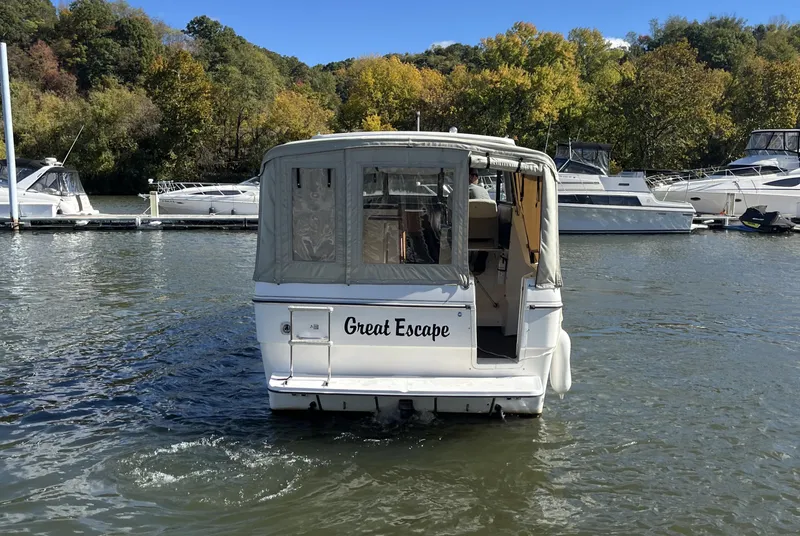 Slide: The Image of 1995 Bayliner 2859 Classic Cruiser "Great Escape" on a scenic lake. - 2