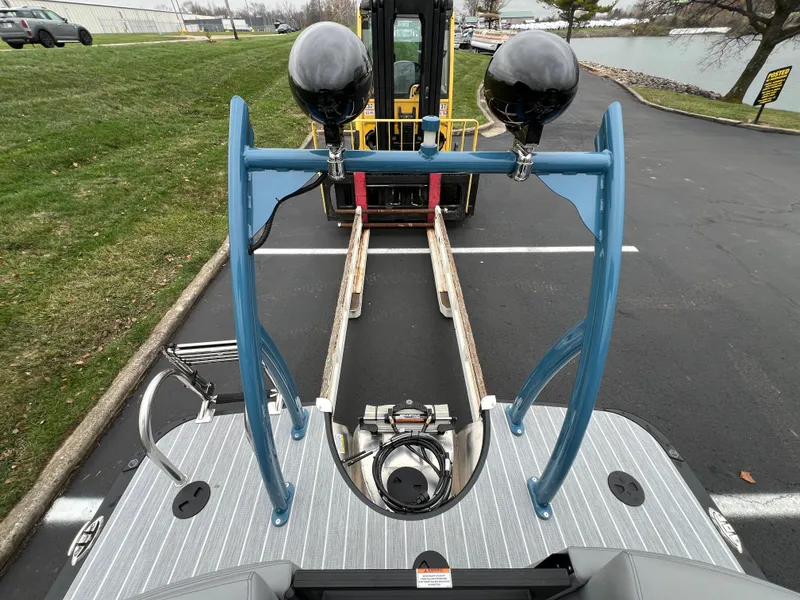 Slide: The Image of 2025 South Bay 523 RS3 3.0+ pontoon boat on trailer, rear view. - 16