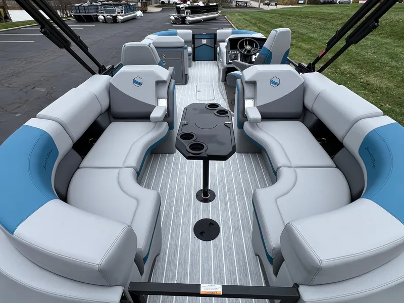 Slide: The Image of 2025 South Bay 523 RS3 3.0+ pontoon boat interior with plush seating and modern design. - 17