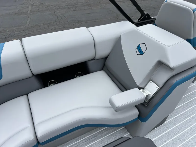 Slide: The Image of 2025 South Bay 523 RS3 3.0+ boat interior with sleek gray seating and blue accents. - 18