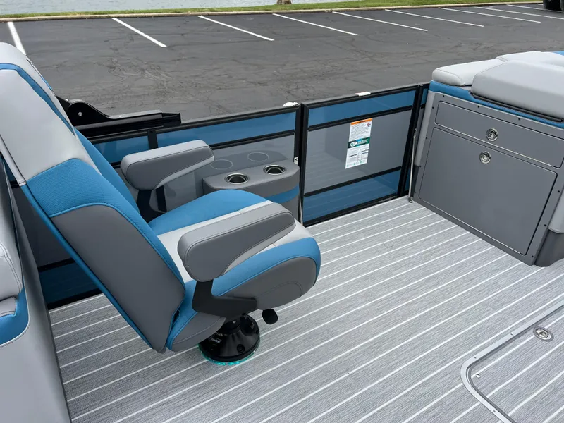 Slide: The Image of 2025 South Bay 523 RS3 3.0+ boat interior with blue and gray seating and striped flooring. - 20