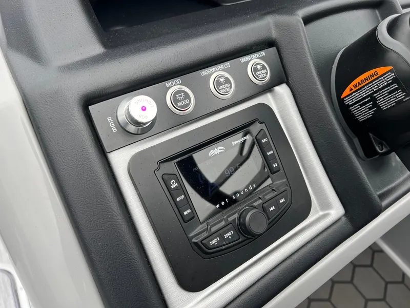 Slide: The Image of Control panel of 2025 South Bay 523 RS3 3.0+ boat with audio system and controls. - 22