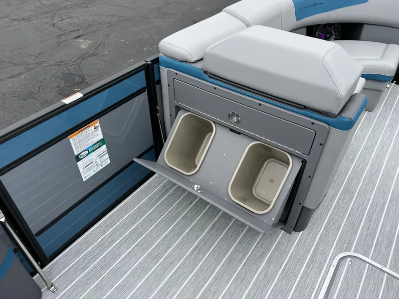 Slide: The Image of 2025 South Bay 523 RS3 3.0+ boat interior with storage compartments and seating. - 25