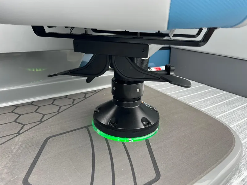 Slide: The Image of Close-up of South Bay 523 RS3 3.0+ boat seat base with green LED light, 2025 model. - 30
