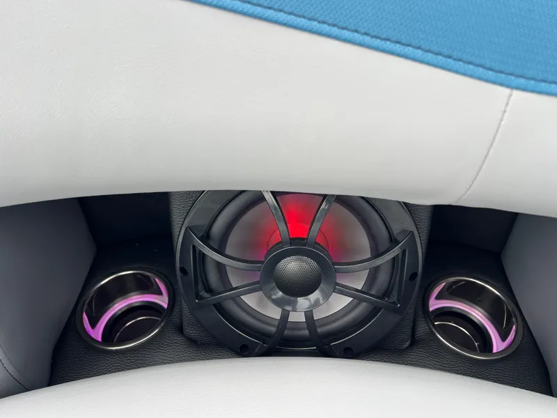 Slide: The Image of 2025 South Bay 523 RS3 3.0+ boat interior with speaker and illuminated cup holders. - 31