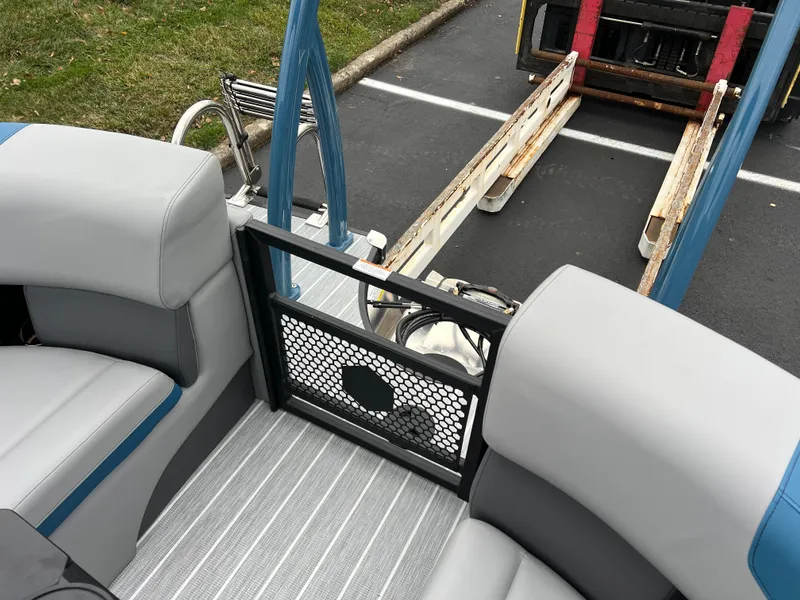 Slide: The Image of 2025 South Bay 523 RS3 3.0+ boat interior with gray seating and striped flooring. - 32