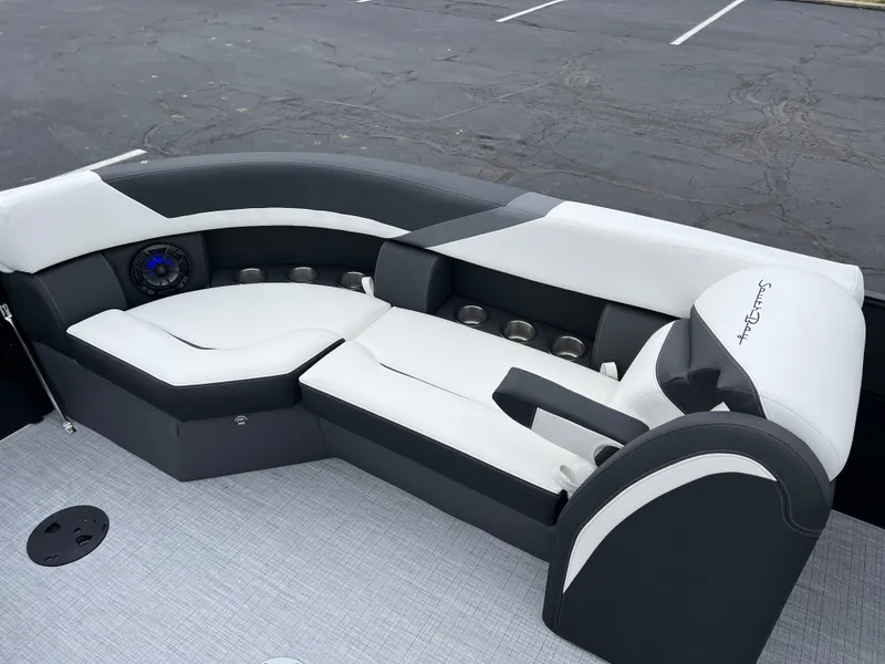 Slide: The Image of 2025 South Bay S224 RS 3.0 Hybrid Arch boat interior with sleek black and white seating. - 14
