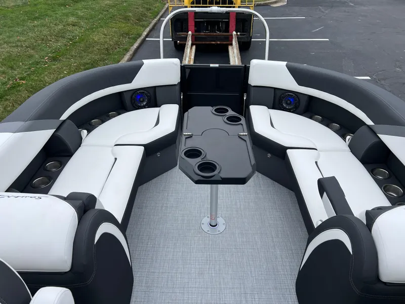Slide: The Image of 2025 South Bay S224 RS 3.0 Hybrid Arch boat interior with sleek seating and table. - 15