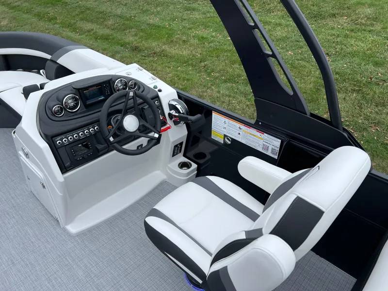 Slide: The Image of 2025 South Bay S224 RS 3.0 Hybrid Arch boat interior with modern helm and seating. - 19