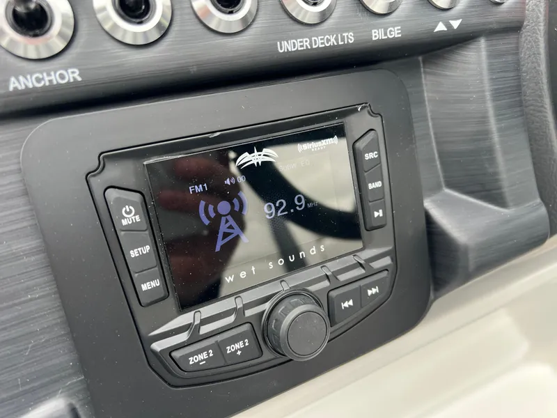 Slide: The Image of Boat dashboard with Wet Sounds radio display, South Bay S224 RS 3.0 HYBRID ARCH, 2025 model. - 22