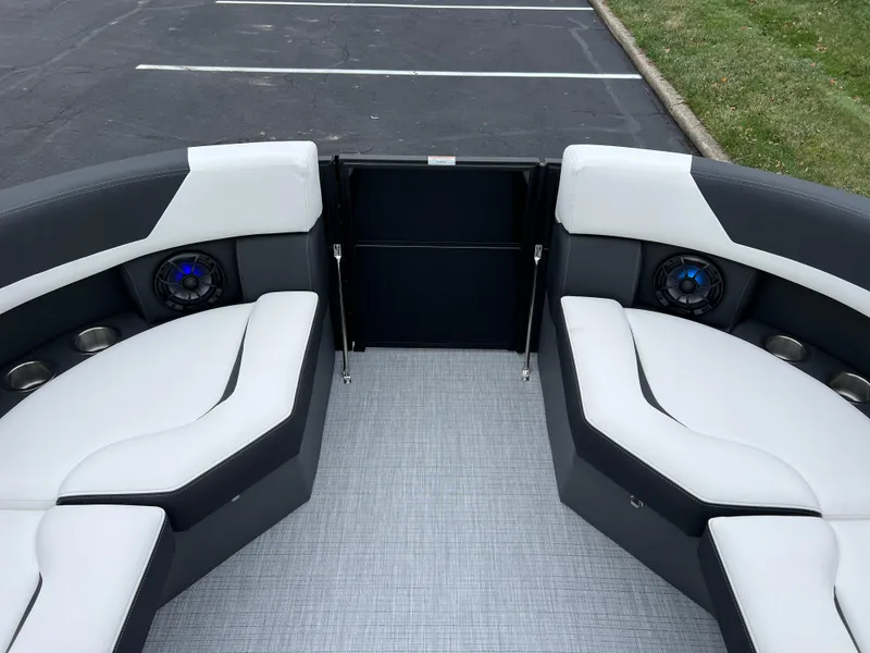 Slide: The Image of 2025 South Bay S224 RS 3.0 Hybrid Arch boat interior with sleek seating and speakers. - 25