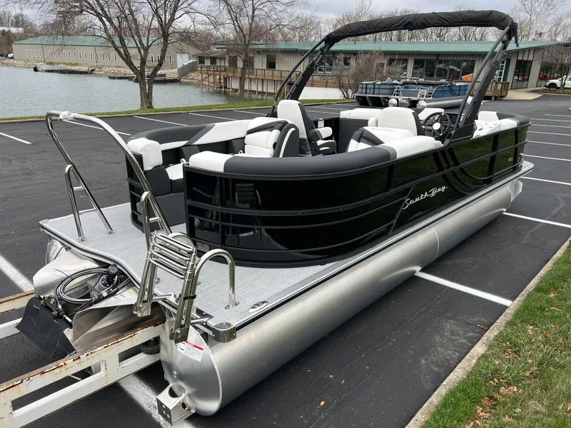 Slide: The Image of 2025 South Bay S224 RS 3.0 Hybrid Arch pontoon boat in parking lot. - 5