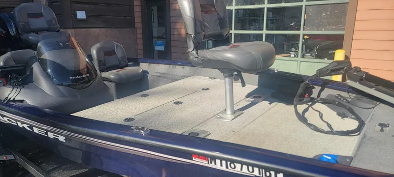 Slide: The Image of 2021 Tracker Pro Team 175 TF fishing boat with seating and steering wheel. - 4