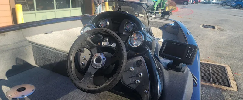 Slide: The Image of 2021 Tracker Pro Team 175 TF boat dashboard with steering wheel and gauges. - 5