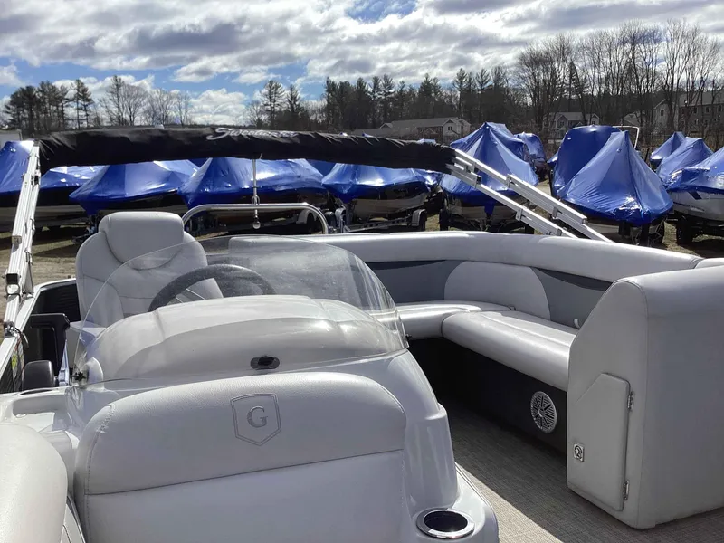 Slide: The Image of 2017 Godfrey SWEETWATER 2086 pontoon boat interior with seating and steering wheel. - 4