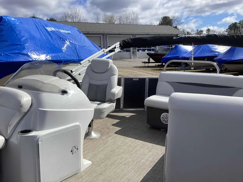 Slide: The Image of 2017 Godfrey SWEETWATER 2086 pontoon boat interior with seating and steering console. - 5