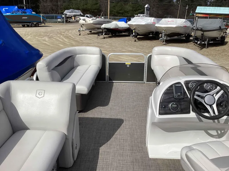 Slide: The Image of 2017 Godfrey SWEETWATER 2086 pontoon boat interior with plush seating and modern dashboard. - 6