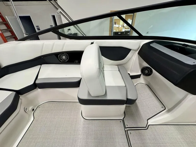 Slide: The Image of Interior of 2025 Regal 2000 ES boat with white and black seating. - 10