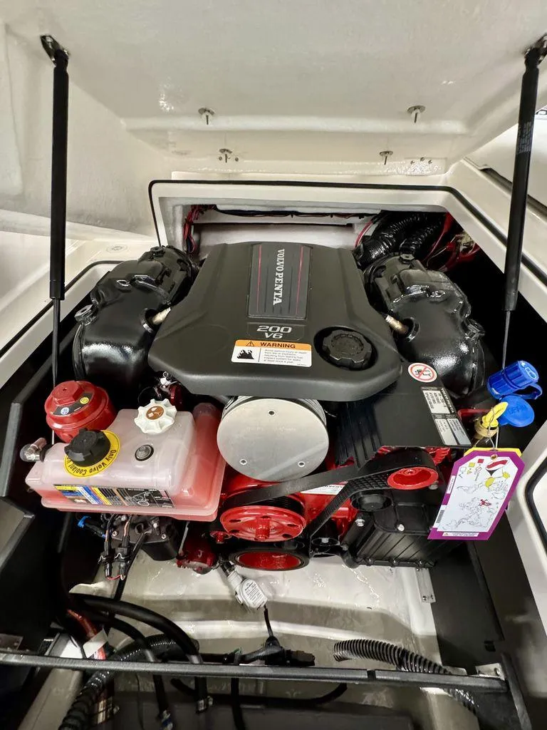 Slide: The Image of Engine compartment of a 2025 Regal 2000 ES boat, featuring a Volvo Penta engine. - 14