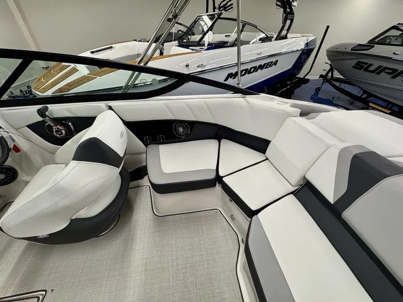 Slide: The Image of 2025 Regal 2000 ES boat interior with white and black seating, showcasing modern design. - 7