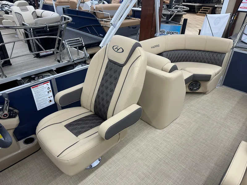 Slide: The Image of 2024 Harris Sunliner 230 boat interior with beige and black seating. - 7