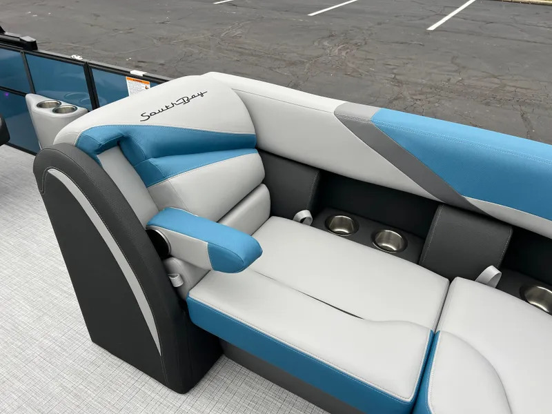 Slide: The Image of 2025 South Bay S224UL boat seating with blue and gray upholstery. - 11