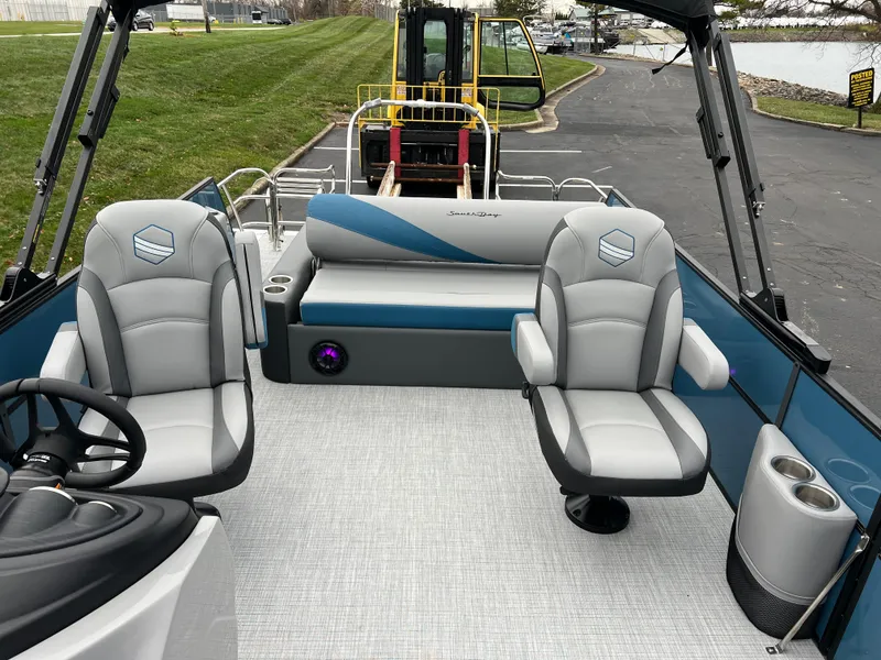 Slide: The Image of 2025 South Bay S224UL pontoon boat interior with plush seating and modern design. - 12