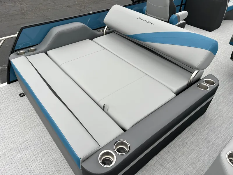 Slide: The Image of 2025 South Bay S224UL boat seating with cup holders, gray and blue upholstery. - 14