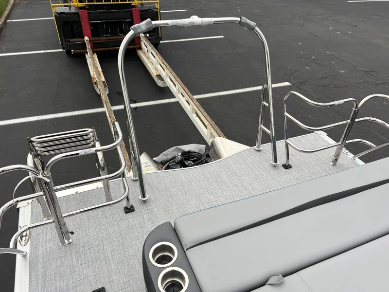 Slide: The Image of 2025 South Bay S224UL pontoon boat with sleek seating and stainless steel railings. - 16