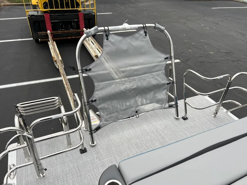 Slide: The Image of 2025 South Bay S224UL pontoon boat deck with railing and seating. - 17