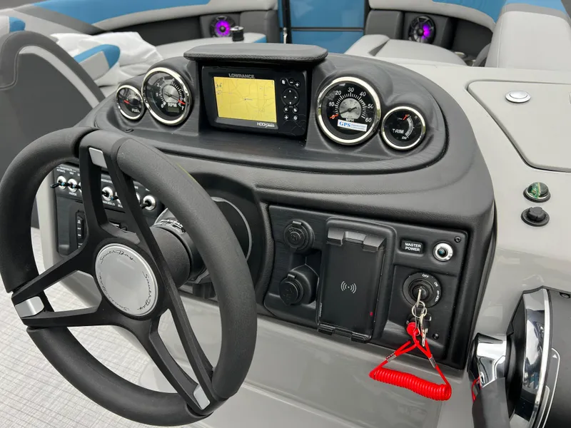 Slide: The Image of 2025 South Bay S224UL boat dashboard with steering wheel and navigation controls. - 21