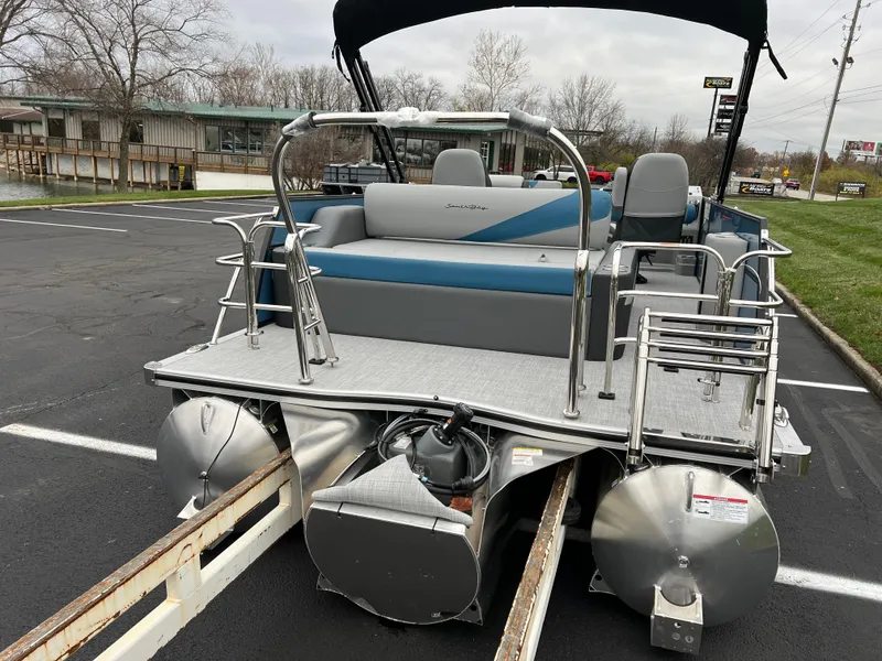 Slide: The Image of 2025 South Bay S224UL pontoon boat on trailer in parking lot. - 5
