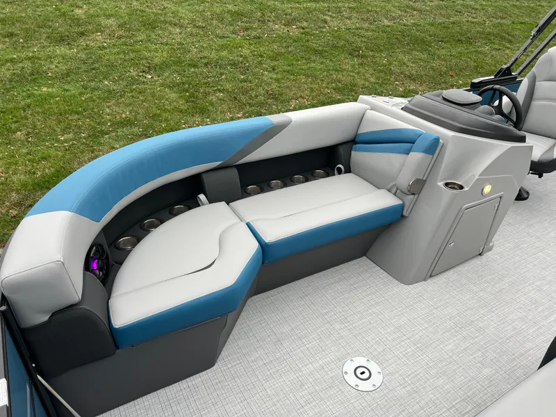 Slide: The Image of 2025 South Bay S224UL pontoon boat interior with blue and gray seating. - 9