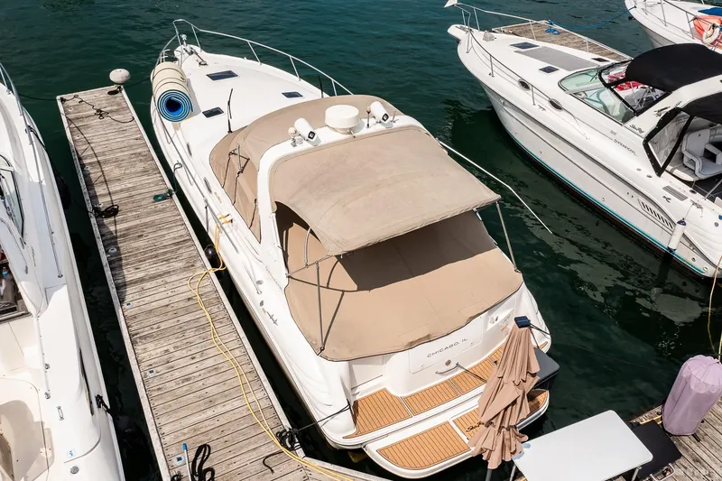 Slide: The Image of 1998 Sea Ray 330 Sundancer docked at marina, aerial view. - 13