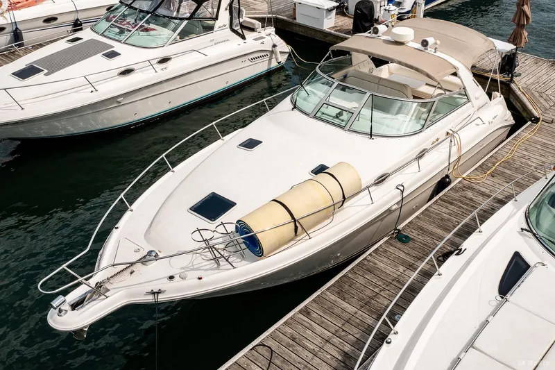 Slide: The Image of 1998 Sea Ray 330 Sundancer docked at marina, aerial view. - 3