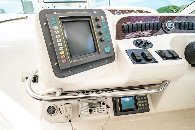 Slide: The Image of Control panel of a 1998 Sea Ray 330 Sundancer boat with navigation equipment. - 30