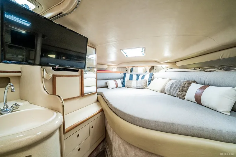 Slide: The Image of Luxurious interior of 1998 Sea Ray 330 Sundancer yacht with cozy seating and modern amenities. - 43