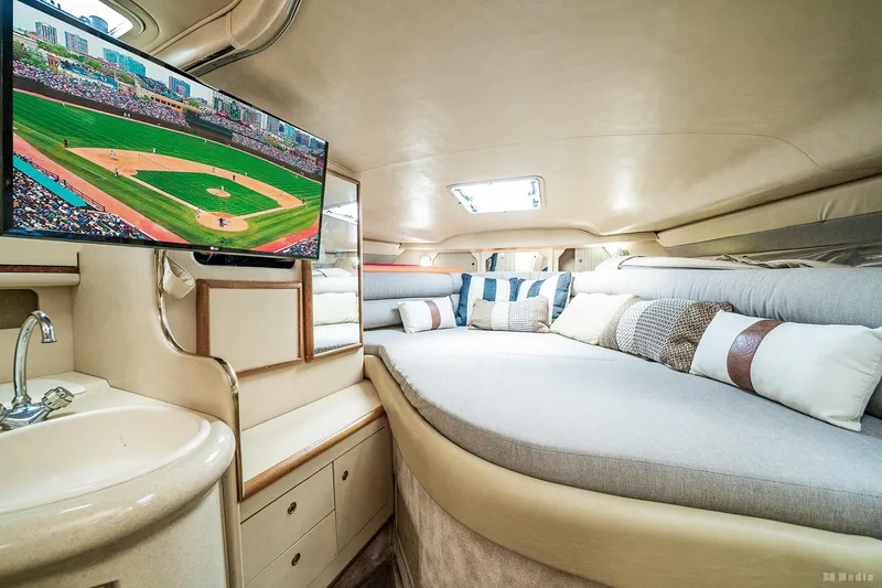 Slide: The Image of Luxurious interior of 1998 Sea Ray 330 Sundancer with TV and cozy seating area. - 44
