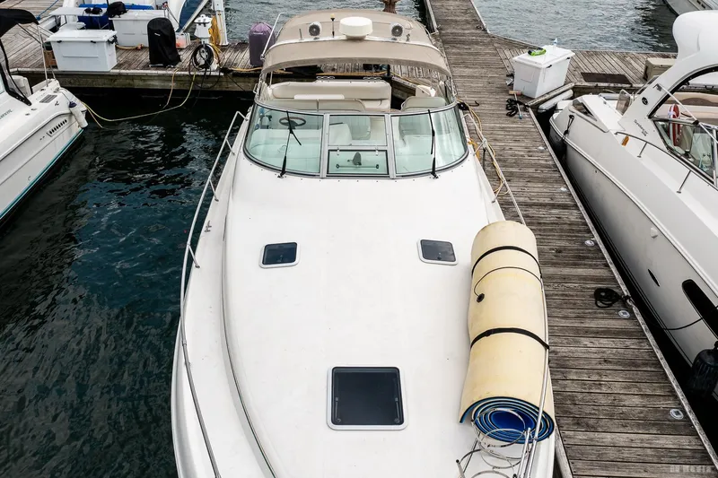 Slide: The Image of 1998 Sea Ray 330 Sundancer docked at marina, top view. - 7
